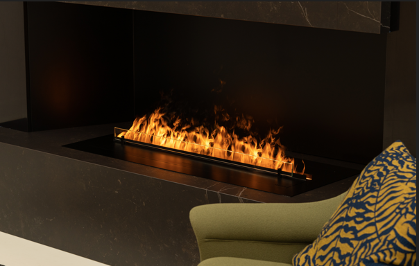 Close-up view of a modern built-in fireplace with bright linear flames set in a dark stone surround, with part of an upholstered chair and patterned cushion visible in the foreground.